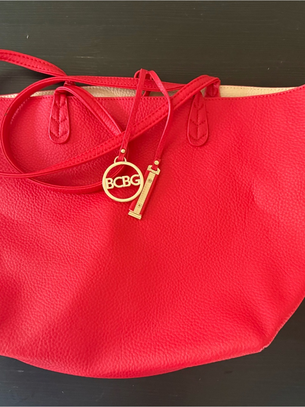 BCBG Bright Red Pebbled Leather Tote with Gold Logo Charm
